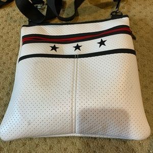 Neo-prene cross body bag by Haute Shore